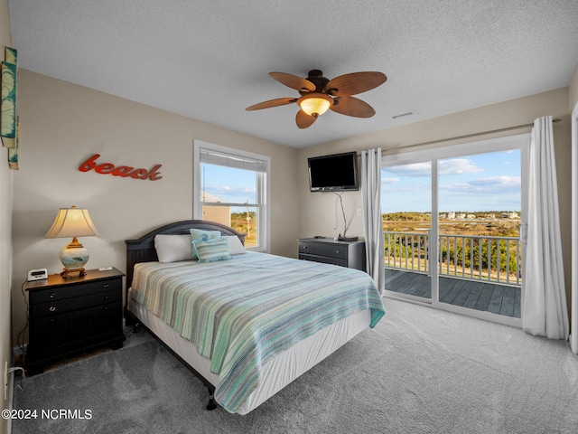 bedroom featuring multiple windows, carpet floors, and ceiling fan