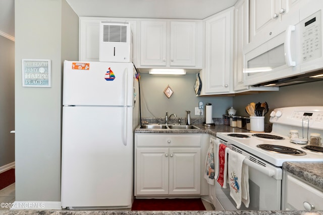 kitchen featuring sink, white cabinets, and white appliances