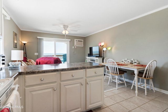 kitchen featuring crown molding, an AC wall unit, light tile patterned floors, and white cabinets