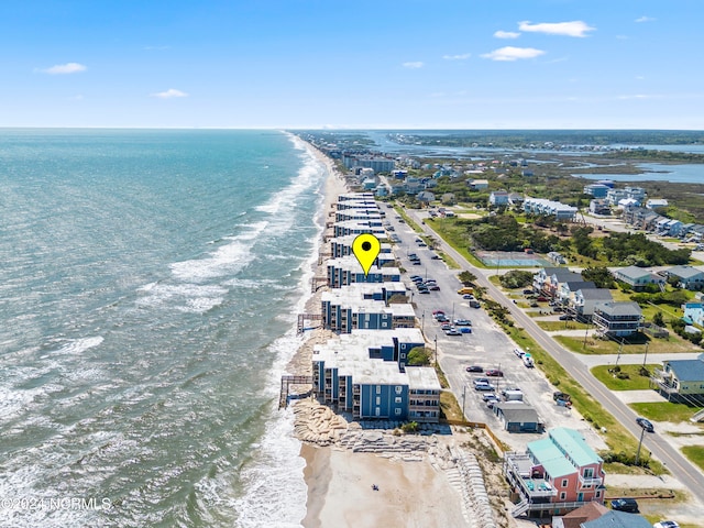 bird's eye view with a water view and a view of the beach