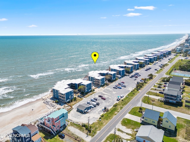 aerial view with a water view and a view of the beach