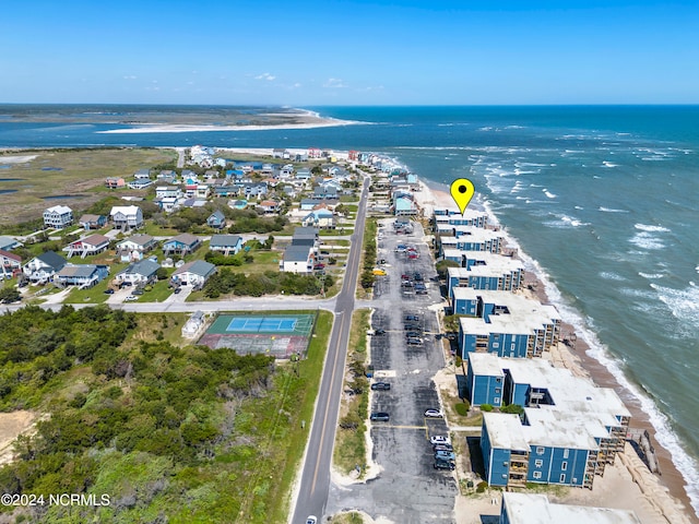 bird's eye view with a water view and a view of the beach