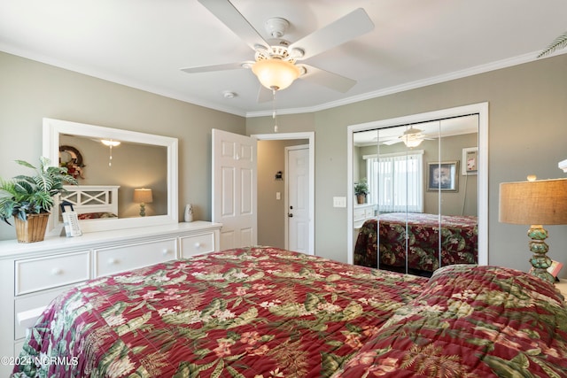 bedroom with crown molding, a closet, and ceiling fan