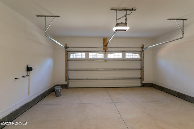 garage featuring a garage door opener