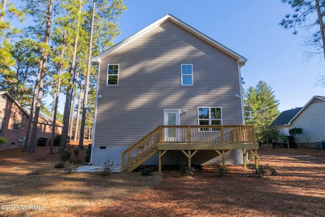 rear view of property featuring a deck and central AC unit