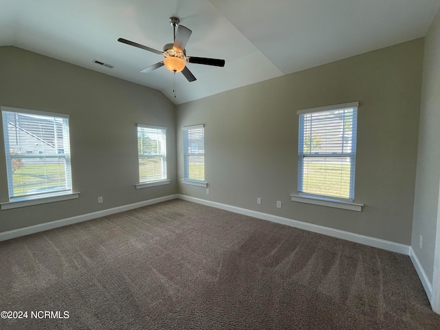 unfurnished room featuring carpet flooring and vaulted ceiling