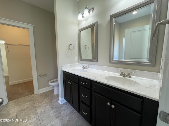 bathroom featuring vanity, toilet, and tile patterned floors