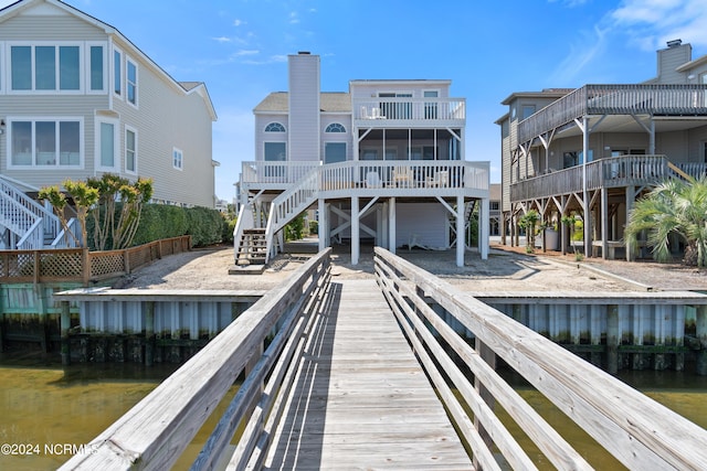 back of house featuring a water view