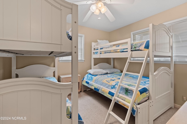 bedroom featuring ceiling fan and light carpet