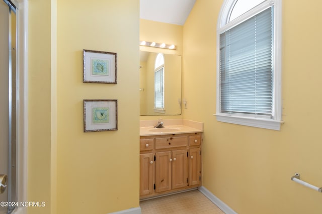 bathroom featuring tile flooring and large vanity