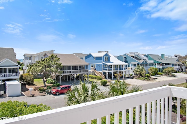 exterior space with a carport and a balcony