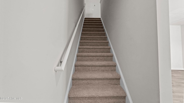 stairway with baseboards