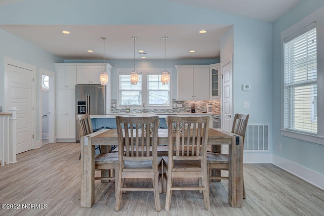 dining room featuring light wood-type flooring