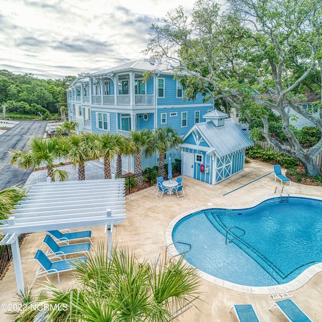 view of swimming pool with a patio