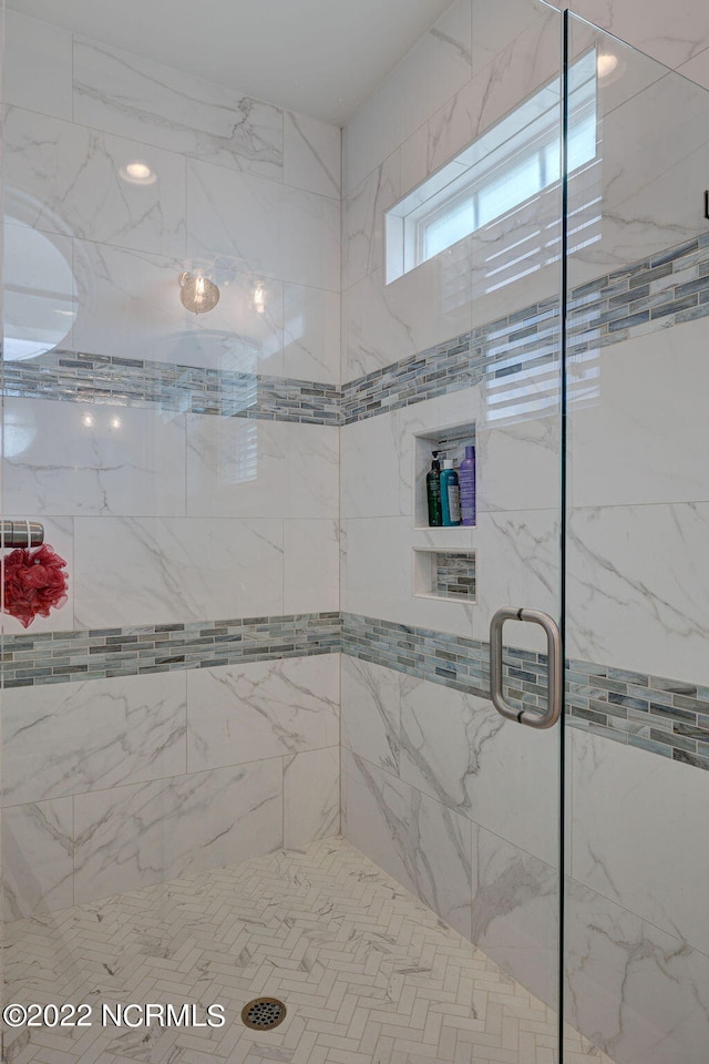 bathroom featuring an enclosed shower