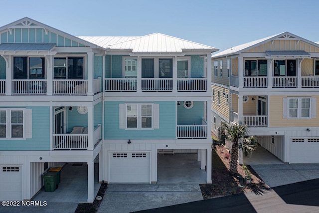 view of front of property with a balcony and a garage