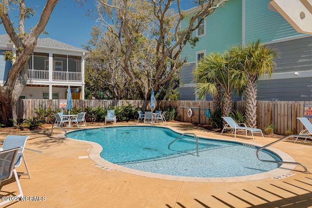 view of swimming pool with a patio area