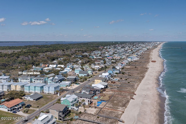 aerial view featuring a view of the beach and a water view