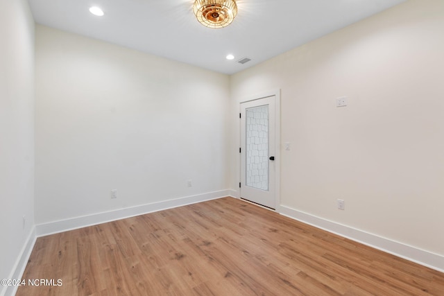 unfurnished room featuring light wood-type flooring