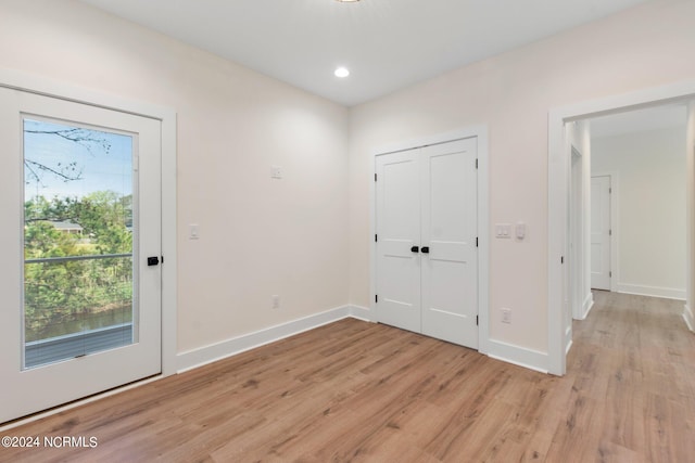 doorway with light wood-type flooring