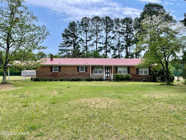 ranch-style home with a front lawn