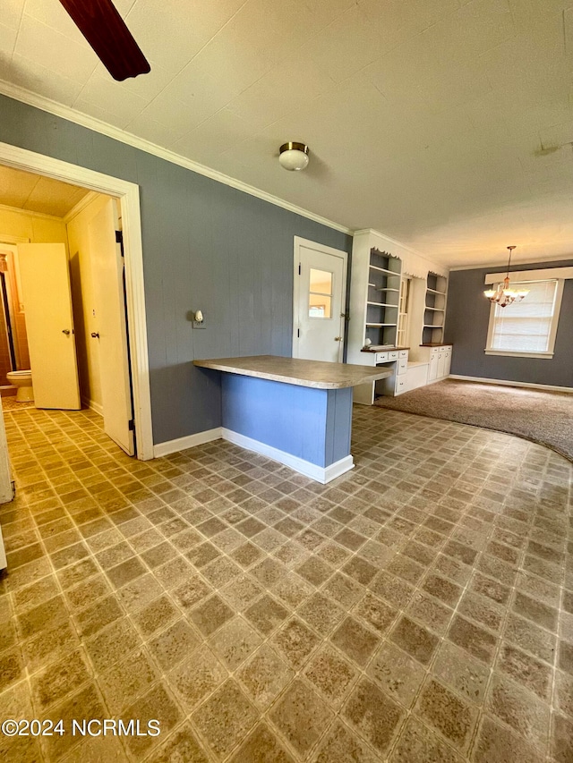 tiled empty room featuring ceiling fan with notable chandelier and crown molding