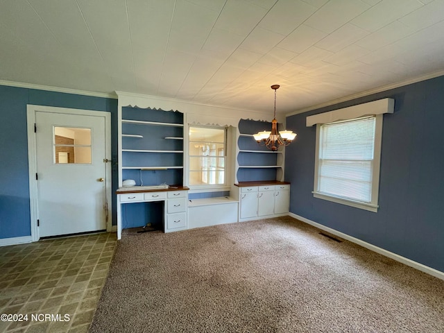 unfurnished room with dark carpet, crown molding, and a notable chandelier