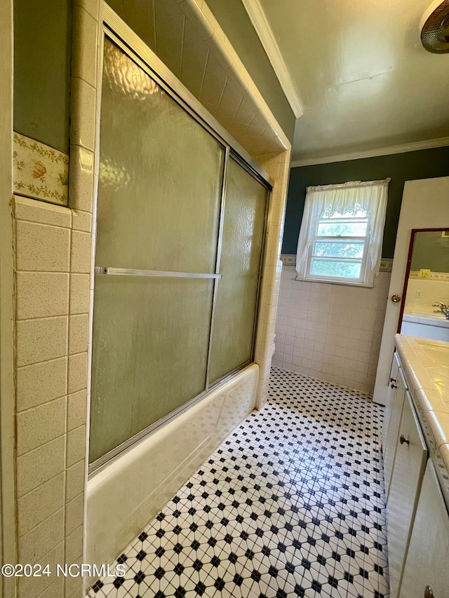 bathroom with ornamental molding, tile floors, vanity, and tile walls