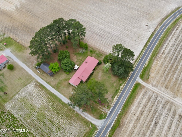 birds eye view of property with a rural view