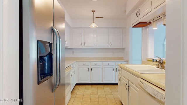 kitchen with pendant lighting, white cabinetry, white dishwasher, sink, and stainless steel fridge with ice dispenser