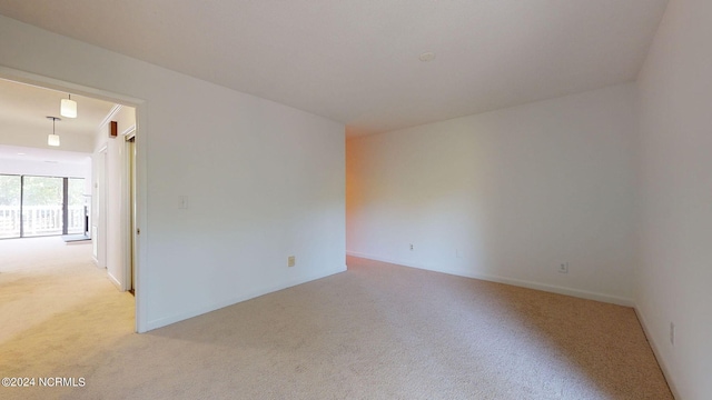 spare room featuring carpet floors