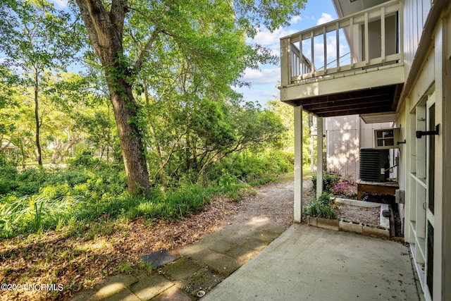 view of patio / terrace with central AC and a balcony