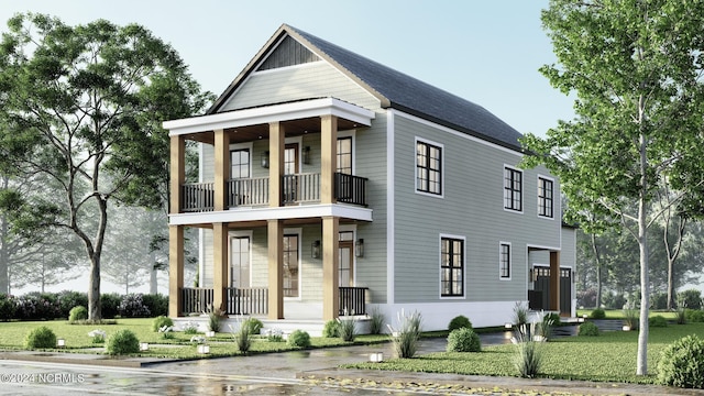 view of front facade with a balcony and a front lawn