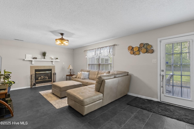 167 Dockside Dr, Jacksonville, NC 28546 - living area with healthy amount of natural light, a fireplace, a textured ceiling, and baseboards