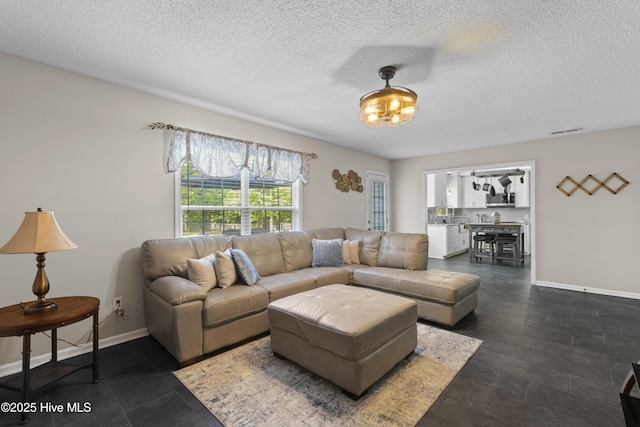 167 Dockside Dr, Jacksonville, NC 28546 - living area featuring baseboards and a textured ceiling