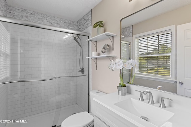 167 Dockside Dr, Jacksonville, NC 28546 - bathroom featuring toilet, a stall shower, vanity, and a textured ceiling
