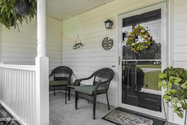 doorway to property featuring covered porch