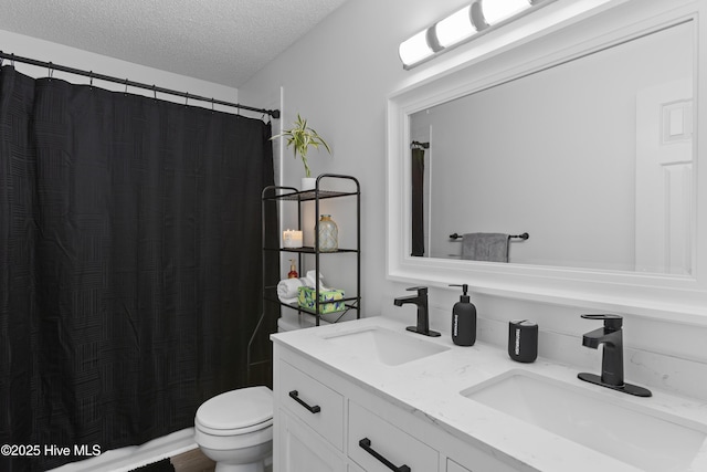 167 Dockside Dr, Jacksonville, NC 28546 - bathroom featuring double vanity, a textured ceiling, toilet, and a shower with shower curtain