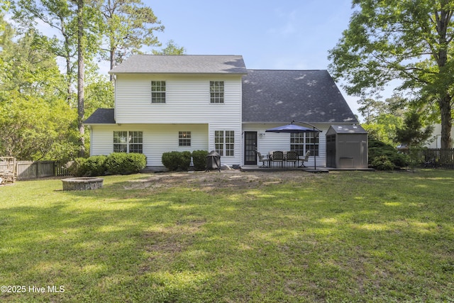 167 Dockside Dr, Jacksonville, NC 28546 - rear view of property featuring a patio area, a fire pit, and roof with shingles