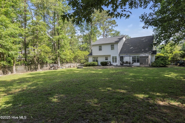 167 Dockside Dr, Jacksonville, NC 28546 - back of house featuring roof with shingles and a patio