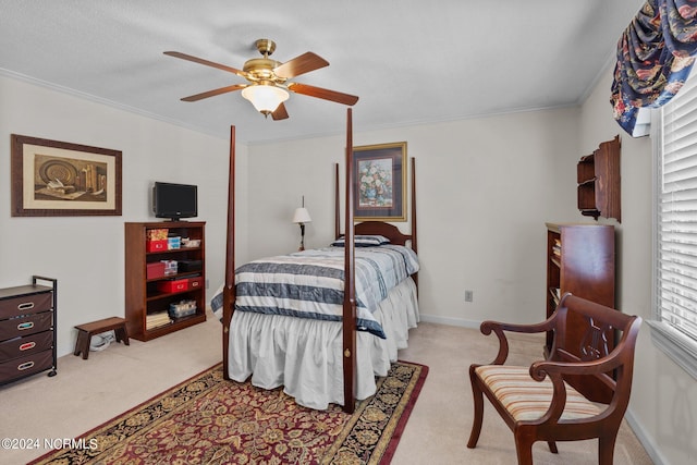 bedroom with light colored carpet, a textured ceiling, ceiling fan, and crown molding