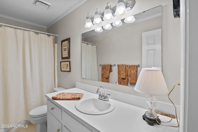 bathroom featuring toilet, a textured ceiling, vanity, tile floors, and ornamental molding