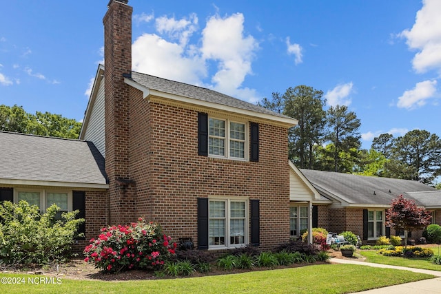 view of front of home with a front yard