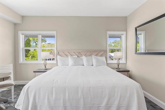 bedroom with dark carpet