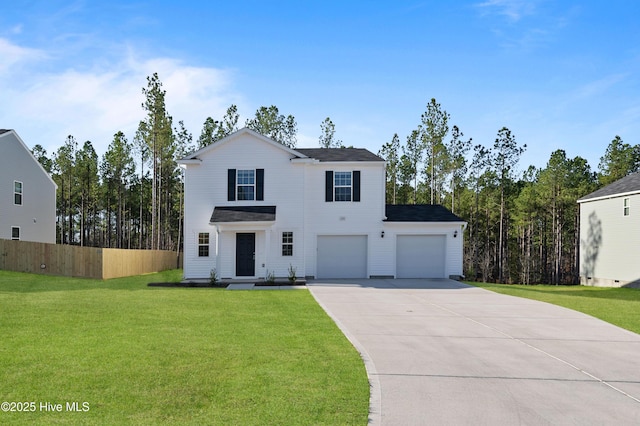 view of front of house with driveway, a front yard, and fence