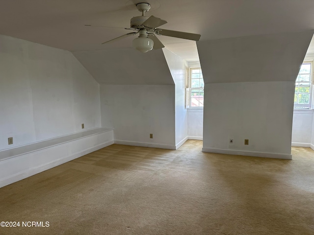 additional living space with lofted ceiling, ceiling fan, and carpet floors