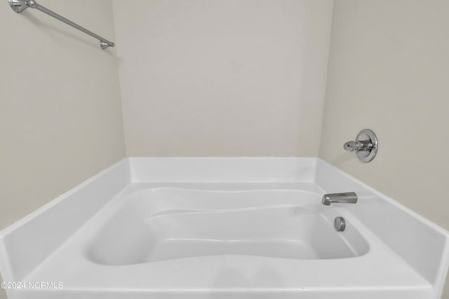 bathroom with a tub to relax in