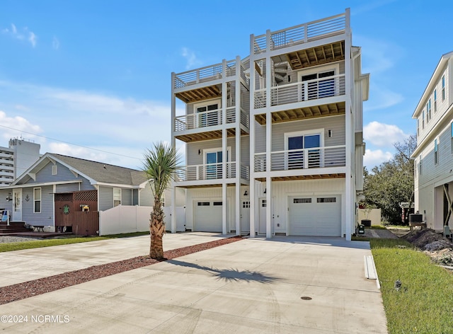 view of front of property with a balcony and a garage