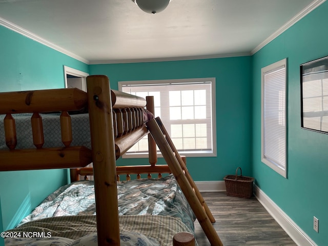 bedroom featuring dark hardwood / wood-style flooring and ornamental molding