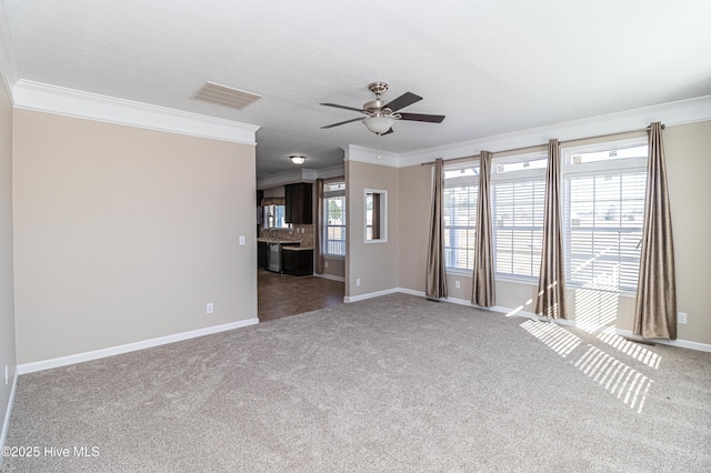 unfurnished living room with carpet floors, ceiling fan, and ornamental molding